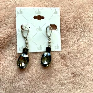 Dangly  Cabi stellar earrings.